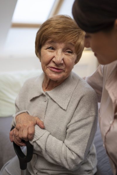 female-nurse-taking-care-elderly-person-2-scaled